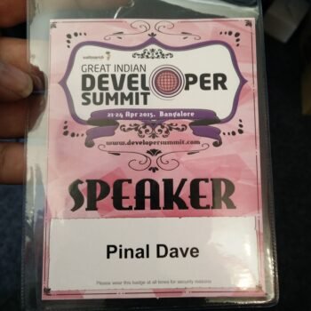A speaker badge at a tech conference.